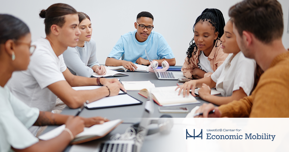 Postsecondary students sitting at a table