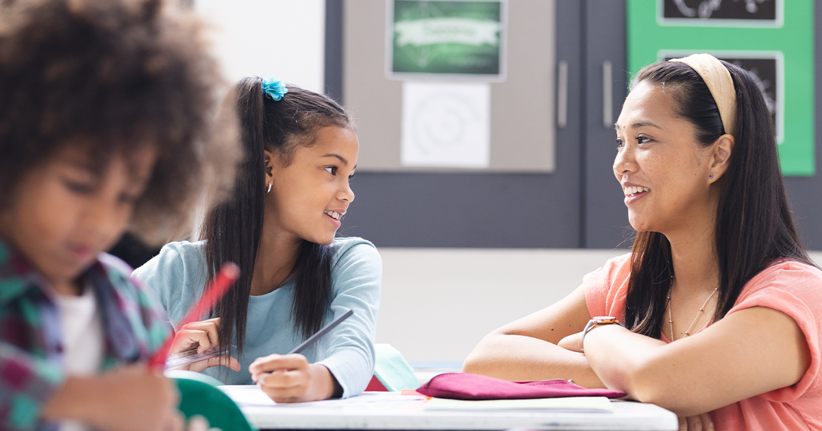 Two students in classroom with teacher