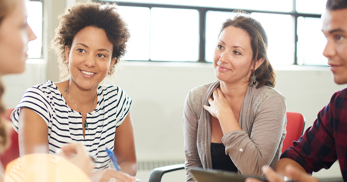 Educators sitting around a table