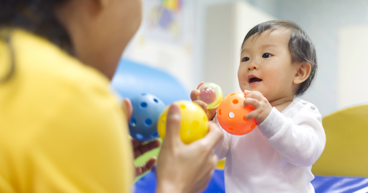 Child playing with caregiver