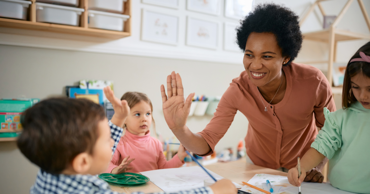 Teacher giving student a high-five