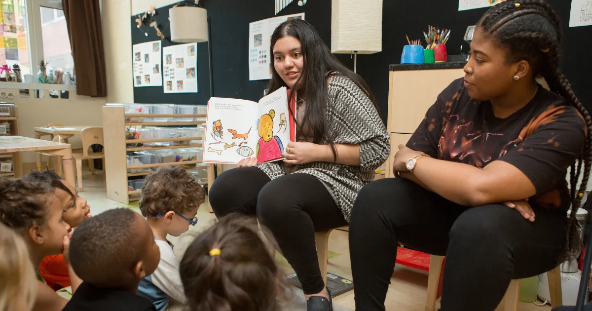 Teachers in a classroom with young students